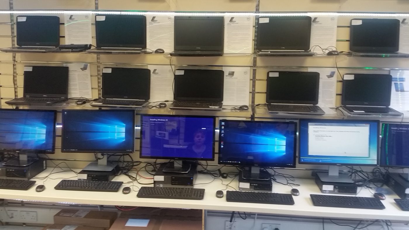 Refurbished Dell laptops and PCs lined up, set up and tested in our Moordown centre
